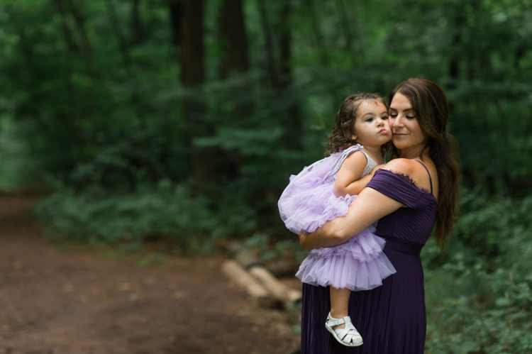 I was thrilled when Michelle from Pink Comb Studio reached out for her maternity photos. Following COVID-19 rule, keeping social distance I photographed Michelle and her two beautiful girls at Watchung Mountain NJ. With overcast weather three trees and grass showed such a rich deep green colors. I love bold rich colors in my photos as much as I love sunset golden hour. Michelle was just glowing and looked so beautiful. Was so happy to have such a beautiful mama in front of my camera before Michelle becomes mama of three girls. I can not wait to see her new baby girl and see her family grow. Michelle Surgent’s maternity session captured by Karis from heykaris.
